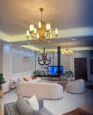 لوستر مدرن لومینا زیتونی ۱۰ شاخه مناسب سالن با طراحی خاص و نوردهی استاندارد