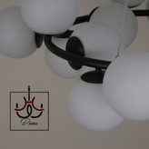 لوستر مولکولی گرد مشکی ۱۵ شعله با طراحی مدرن و نوردهی بالا مناسب فضاهای مختلف